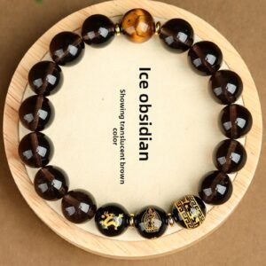 Buddha jewelry:The Natural Obsidian Bracelet combines Chinese Zodiac beads, a Destiny Buddha Guardian, Tiger Eye Stone, Agate, and the Six Character Mantra. Obsidian grounds and protects, while Zodiac beads reflect personal identity. The Destiny Buddha offers guidance, Tiger Eye enhances courage, Agate brings balance, and the mantra infuses sacred energy. Crafted with care, it serves as a powerful talisman and striking accessory, blending natural beauty with spiritual depth.