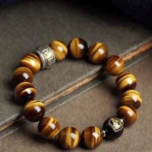 Buddha jewelry:The Natural Yellow Tiger's Eye Bead Bracelet features yellow tiger's eye beads, the Six-Syllable Mantra, and functions as Buddhist prayer beads with fortune-turning properties. Yellow tiger's eye brings strength and clarity, while the mantra invokes compassion and protection. As prayer beads, it aids meditation, and its design supports positive change. Crafted with care, it serves as a powerful talisman and devotional tool, merging natural beauty with spiritual purpose.