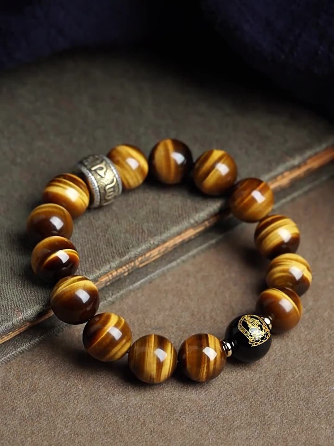 Buddha jewelry:The Natural Yellow Tiger's Eye Bead Bracelet features yellow tiger's eye beads, the Six-Syllable Mantra, and functions as Buddhist prayer beads with fortune-turning properties. Yellow tiger's eye brings strength and clarity, while the mantra invokes compassion and protection. As prayer beads, it aids meditation, and its design supports positive change. Crafted with care, it serves as a powerful talisman and devotional tool, merging natural beauty with spiritual purpose.