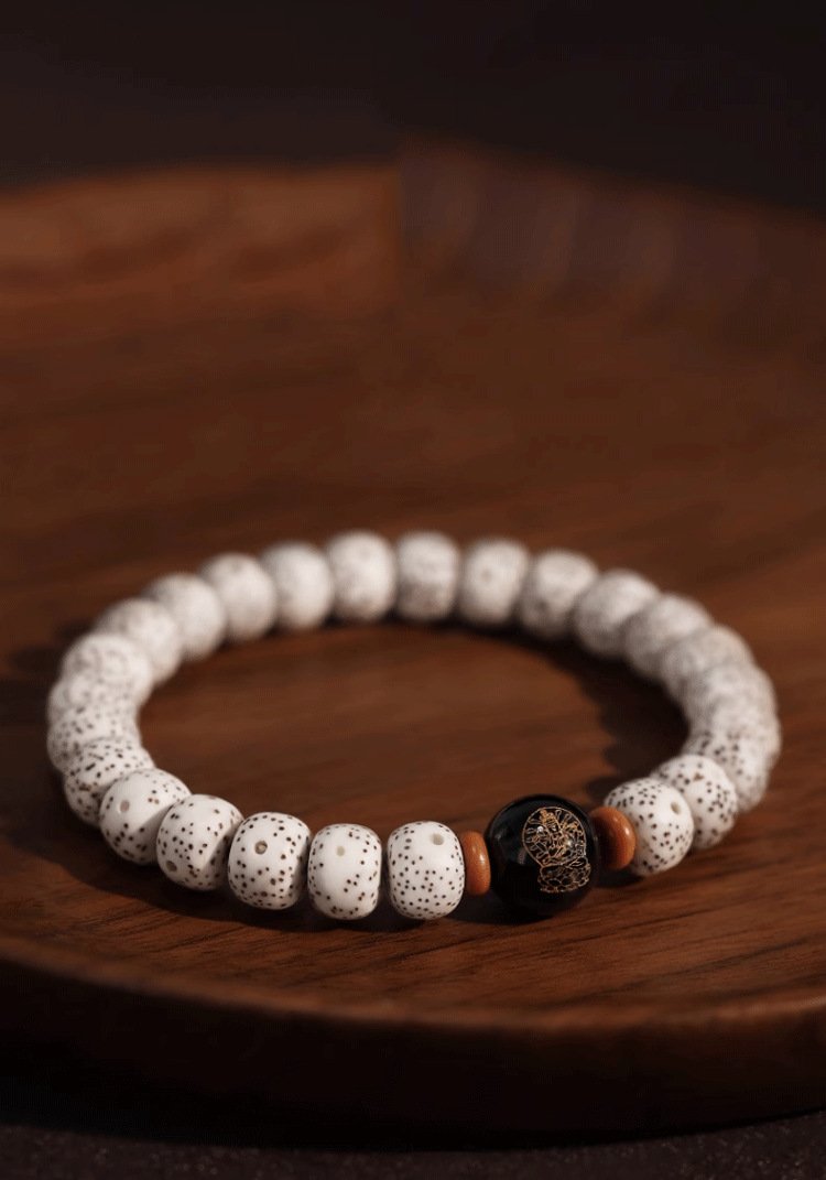 Buddha jewelry:The Natural Star Moon Bodhi Barrel Bead Bodhi Seed Bracelet is a prayer beads bracelet featuring Star Moon Bodhi barrel beads, along with the 12 Chinese Zodiacs and Zodiac Protective Buddhas. The Bodhi seeds symbolize spiritual awakening, while the zodiac beads represent personal identity and the Protective Buddhas offer divine guidance. Crafted with care, it serves as both a devotional tool and a meaningful accessory, growing more beautiful with time as a reflection of the wearer’s spiritual journey.